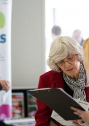 Healthwatch staff member speaking to a member of the public about their experience