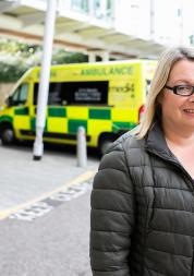Lady standing outside hospital