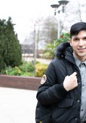 young man smiling at the camera 