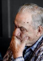 An older man looking down